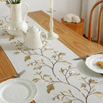 tableau chemin table rustique motifs végétaux franges beige branches feuilles textures tissées bohème