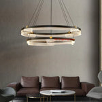 suspension lumineuse moderne noir doré ampoules led blanc translucide structure circulaire bandes translucides minimaliste