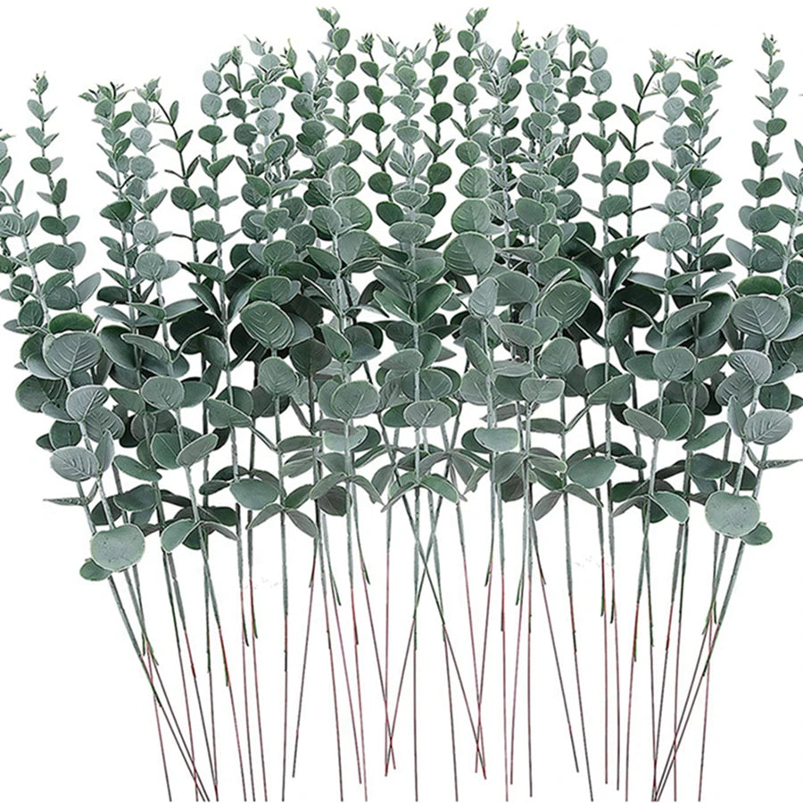 bouquet artificiel feuilles vertes naturel minimaliste ruban blanc vase blanc tapis beige ornement extérieur