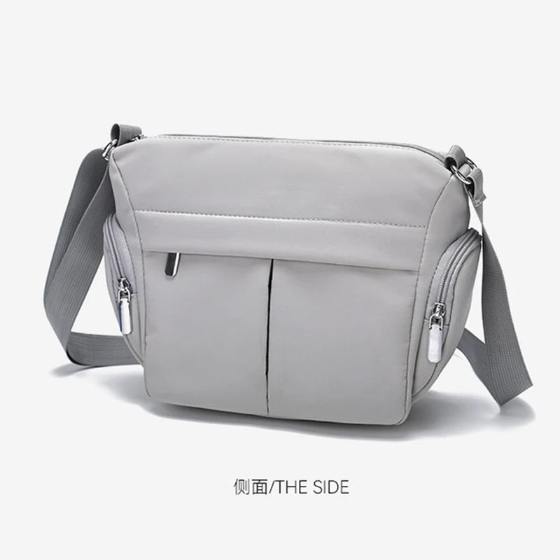 sac bandoulière femme gris clair toile uni moderne ajustable poignée amovible poches ferméreau