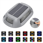 lampe solaire gris métallisé surface rugueuse panneaux solaires intégrés moderne minimaliste insertion sol vis