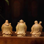 statues sculptées bois naturel artisanal traditionnel trois pièces bébé motifs floraux géométriques maison chambre