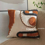 taies d'oreiller géométriques brodées boho chic couleurs beige orange gris franges respectueuses environnement decoration