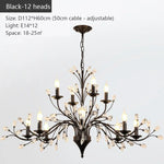 chandelier noir moderne cristaux transparents ampoules blanc chaud suspension élégante branches floralesstylisées
