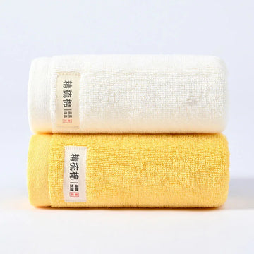 serviettes bain coton douces absorber vert clair jaune gris orange blanc texture duveteuse moderne