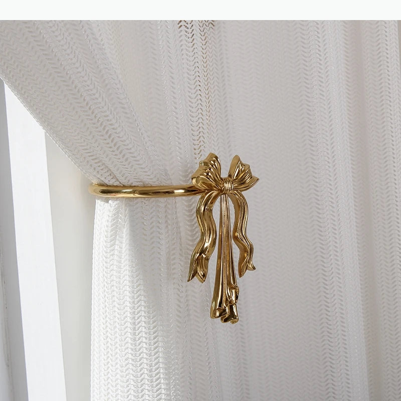 boucles rideau or ailes sculptées classiques décoratives noels dorés deux pièces