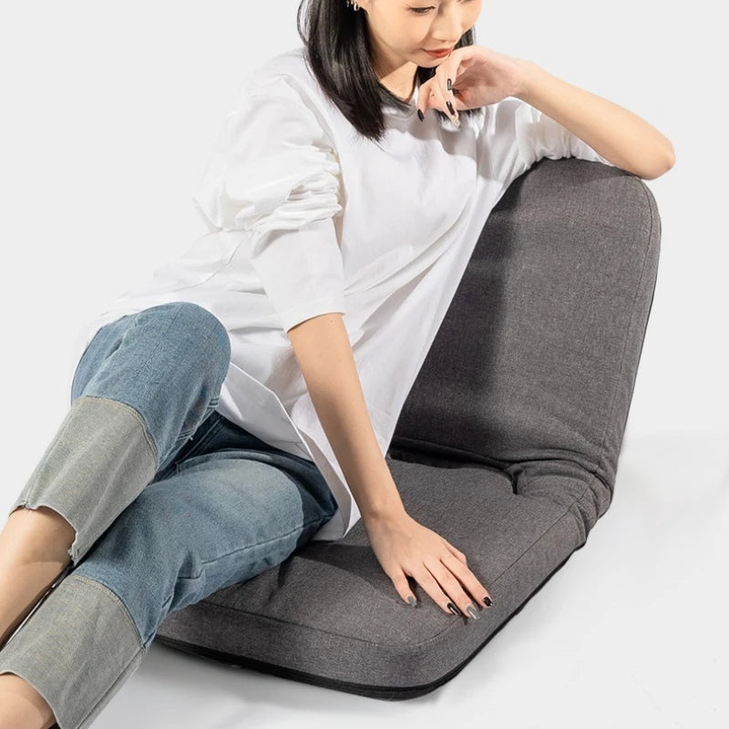 coussin pliable tissu gris moderne minimaliste poignée boutons fermeture confortable assise repos meditation portable