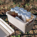 boîtes rangement camping beige vert noir pots conservation couvercle poignées durable respectueux environnement pratique