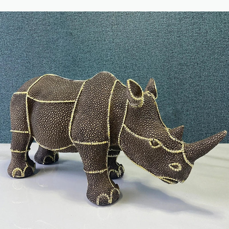 statuette rhinocéros marron foncé texture granuleuse décoratif animalier doré grande petite