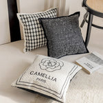 taies d'oreiller décoratives noires blanches motif fleur jacquard respectueuses environnement polyester modernes maison hospitalière
