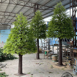 arbre artificiel vert feuilles fines tronc rugueux décoration extérieure réaliste anniversaire maison sol
