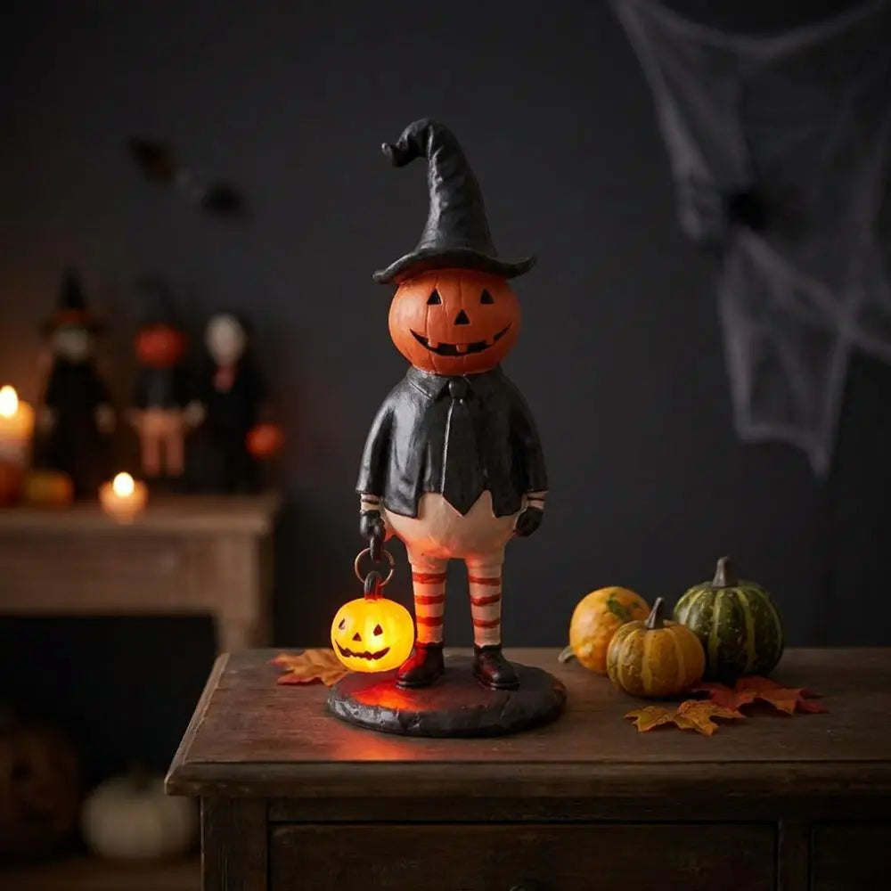 figurine halloween citrouille lumineuse orange visage chapeau robe noire bas rayés automne