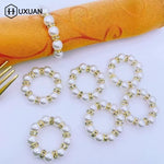 anneau serviette strass dorés classique élégant blanc or événements table luxueux fixations