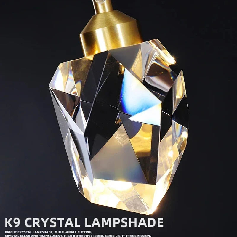 lampe suspendue or transparent cristal facettes géométriques moderne élégante tringles câbles