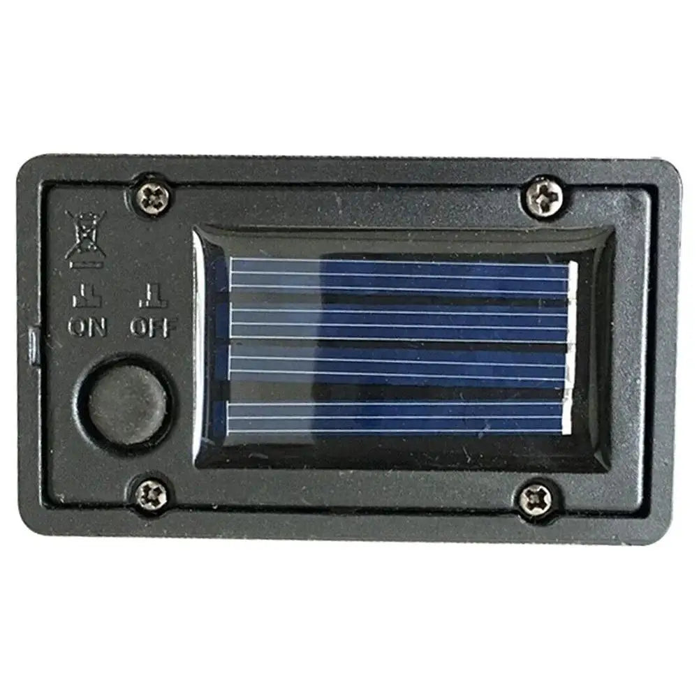 lanterne solaire led panneau texturé boîtier plastique noir ampoule orangée industriel fixations visiblesextérieur