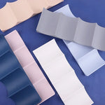 support mural canettes bleu marine rose pâle plissé moderne adhésifversible