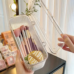boîte maquillage transparente rayures verticales moderne poignée brosse pinceau tampon réutilisable