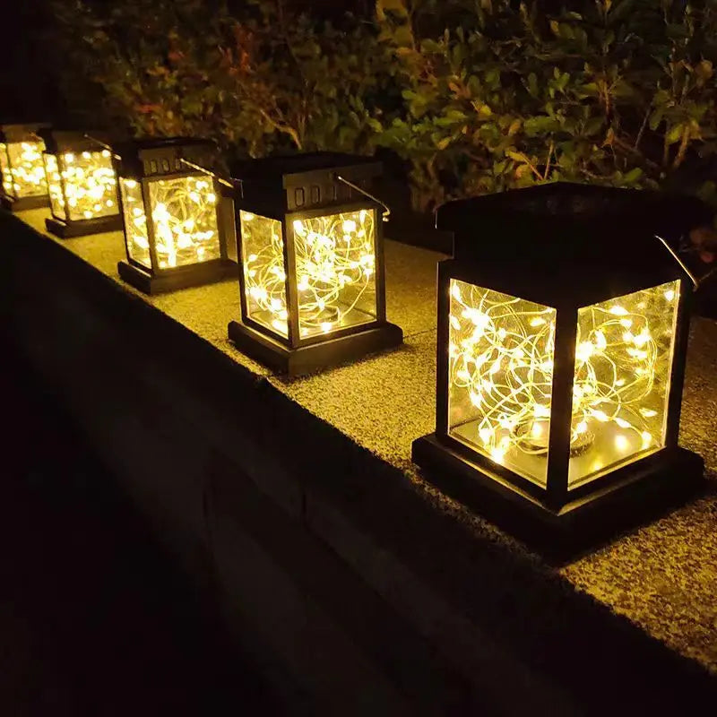 lanterne solaire cuivre noir filet lumineux moderne extérieure jardin cour patio tringle