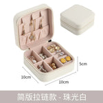 boîte rangement bijoux simili cuir vert clair rose pâle noir moderne pratique fermeture glissière