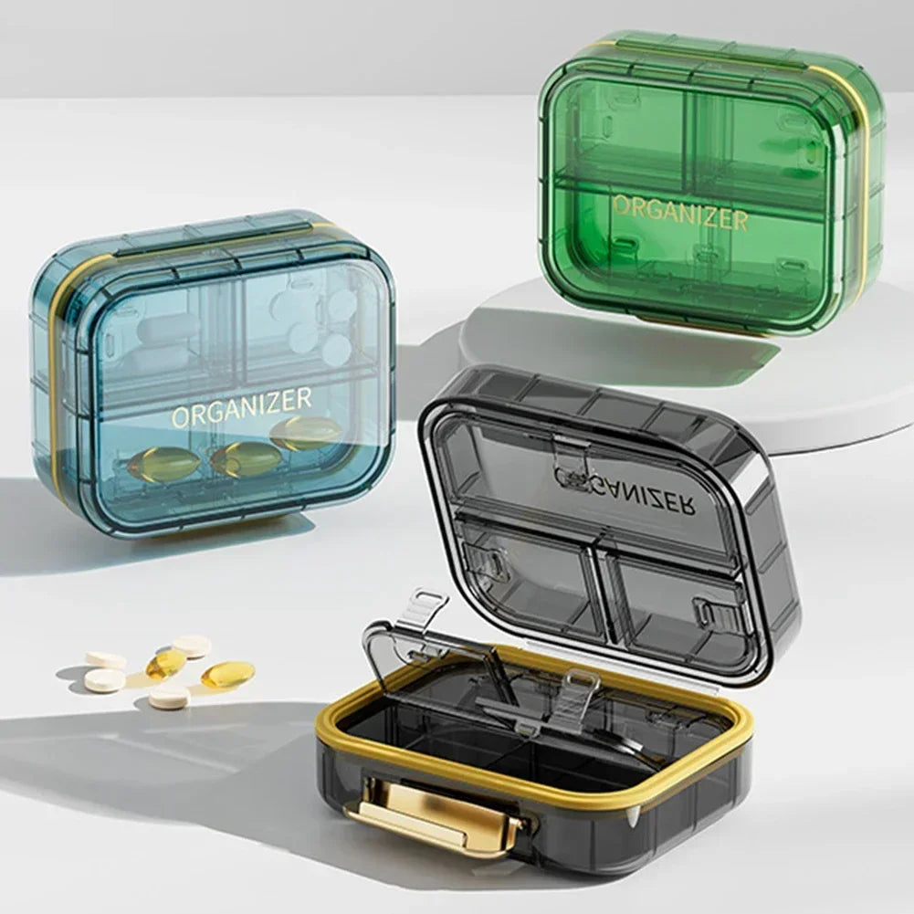 boîte rangement médicaments réutilisable transparente moderne vert bleu violet poignée dorée compartments