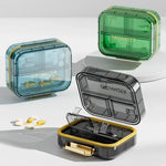 boîte rangement médicaments réutilisable transparente moderne vert bleu violet poignée dorée compartments