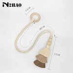 rideau boho chic anneaux bois pompons coton beige clair uni