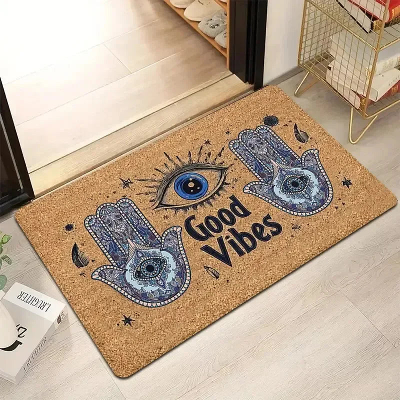 tapis d'entrée moderne marron clair bleu noir doré motif oeil géométrique bienvenue extérieur decoration