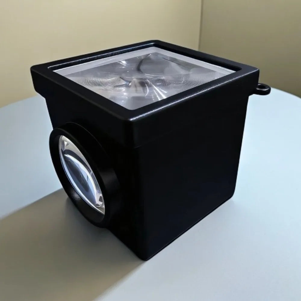 cube optique contemporain noir blanc objectif optique portable studio matériau opacique