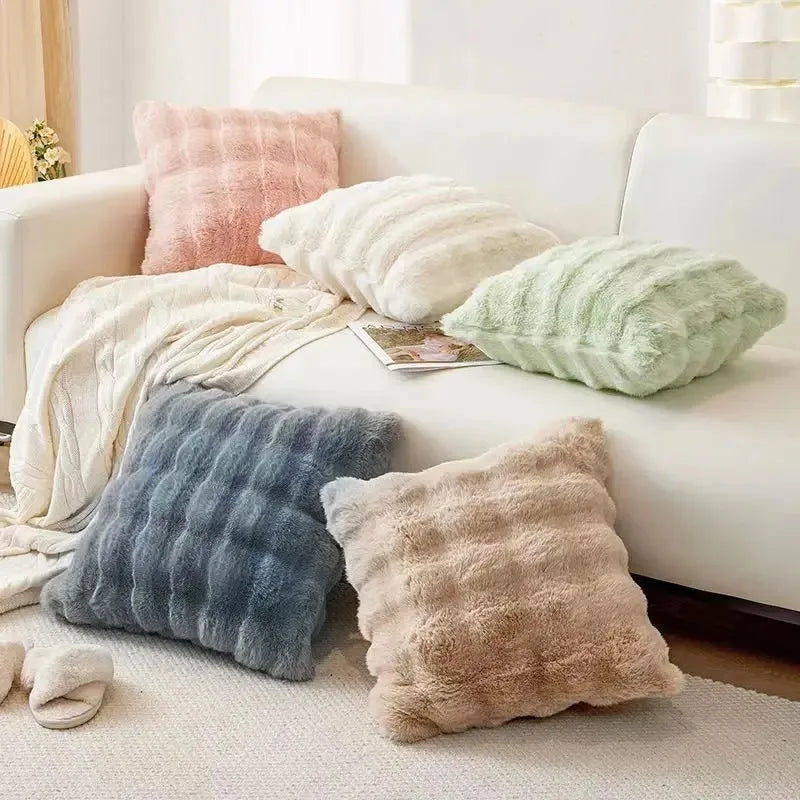 coussins rectangulaires peluche douce rose clair vert pastel lit tissé rayures horizontales moderne respectueux