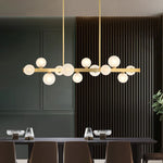 suspension lumineuse moderne or blanc boules translucides chaines interrupteur tactile