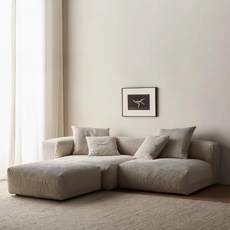 canapé modulaire velours rayures beige clair moderne salon bois oreillers minimaliste