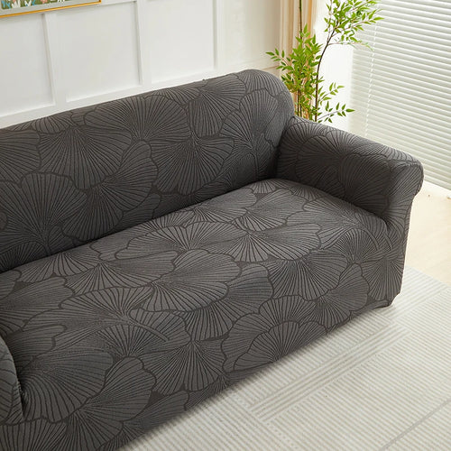 housse canapé jacquard motif feuilles vert olive moderne boutons pression antidérapante