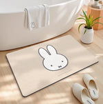 tapis bain dessin animé lapins gris jaune vert bleu rayures enfantin absorbant