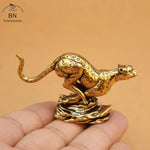 statuette léopard doré taches marron clair base vague artisanat décoration maison traditionnelle asiatique