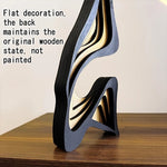 sculpture bois moderne abstraite rayures horizontales noir beige décoration intérieure épurée minimaliste