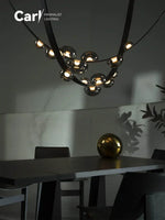 lustre suspension moderne minimaliste noir transparent doré globes organiques chambre salon