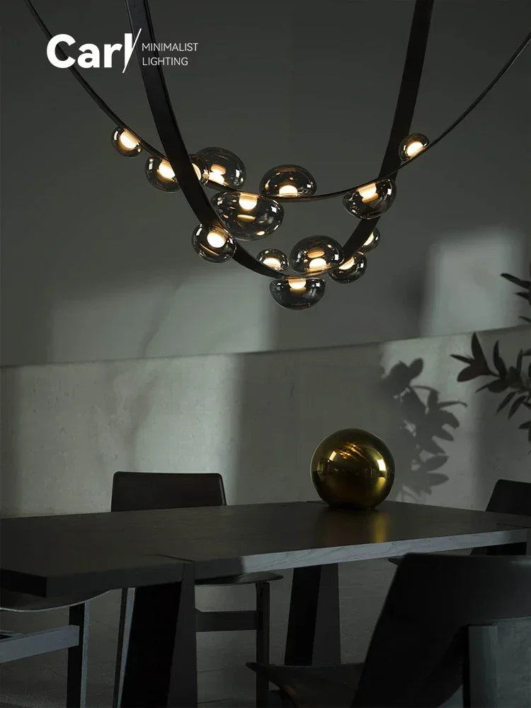 lustre suspension moderne minimaliste noir transparent doré globes organiques chambre salon