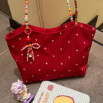sac bandoulière toile rouge fleur blanche femme doux casual pince linge floral opacité