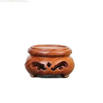 support bois sculpté vintage marron clair découpes décoratives artisanat traditionnel stand thé pot