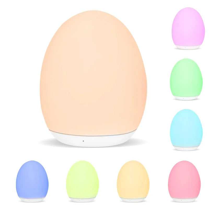 Lampe de chevet LED ovale blanc chaud sur table de nuit moderne