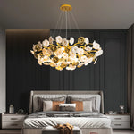 Suspension lumineuse contemporaine dorée fleurs stylisées salon chambre d'hôtel led sources lumière