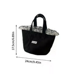 sac main femme noir texture veloutée moderne poignées étiquette logo