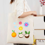 sac main toile beige fruits fleurs imprimé poignées réutilisable respectueux environnement multiful usage