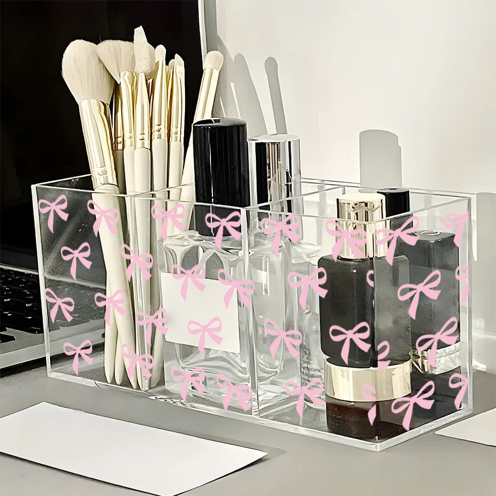 boîte rangement transparente rubans roses pinceaux maquillage bouteilles vernis moderne élégante pratique organisatrice