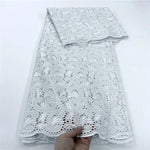 tissu dentelle coton blanc motifs floraux broderie strass robe couture luxe