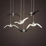 suspension lumineuse moderne oiseau stylisé noir blanc câbles opacité chambre salon