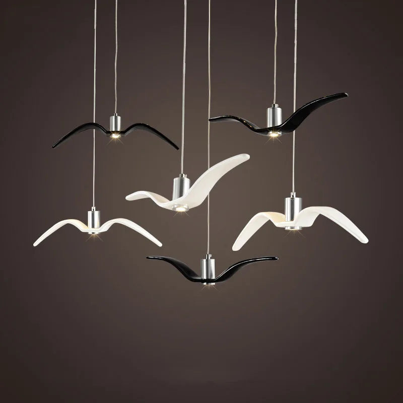 suspension lumineuse moderne oiseau stylisé noir blanc câbles opacité chambre salon