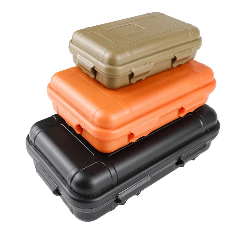 boîtes rangement survie pleine nature orange marron noir étanches flottantes outils edc pratique robuste
