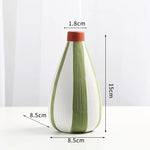 vase moderne céramique rayures vert blanc rouge table décoration fleurs artificielles maison étude
