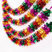 guirlande noel étoiles fleurs métal brillant rouge vert jaune violet rose argenté festive